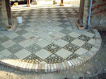 semi circular brick edging to feature paving design